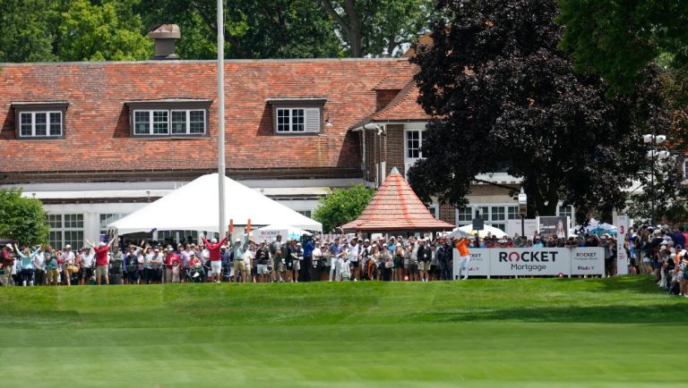 Rickie Fowler hits from the third tee during the final round of the Rocket Mortgage Classic golf tournament at Detroit Country Club, Sunday, June 30, 2024, in Detroit.