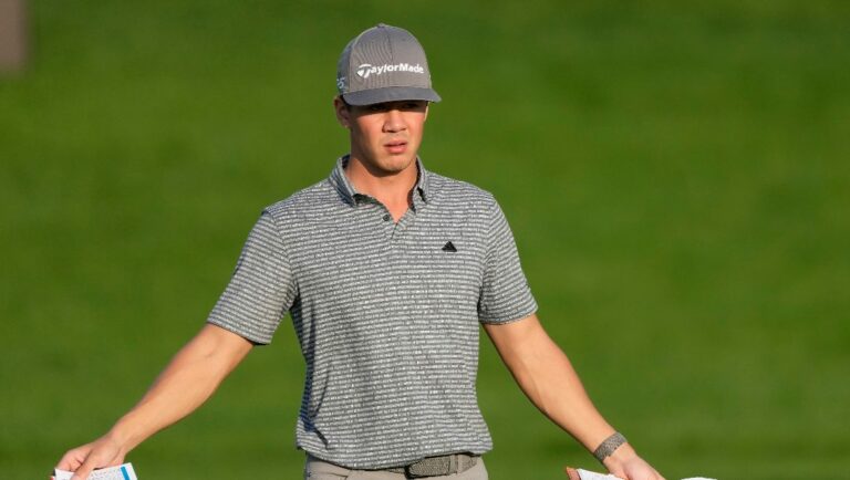 Michael Thorbjornsen of the U.S. prepares for his second shot on the 9th hole during the competition of the second round of the Dubai Desert Classic, in Dubai, United Arab Emirates, Saturday, Jan. 28, 2023.
