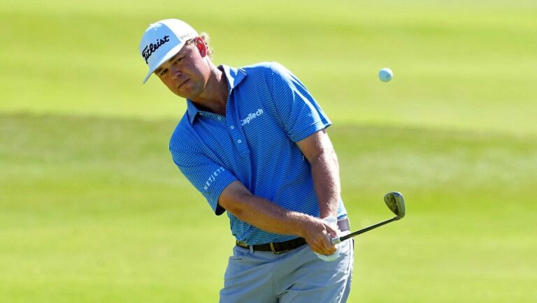 Patton Kizzire chips onto the first green during the third round of the Sony Open golf event, Saturday, Jan. 13, 2024, at Waialae Country Club in Honolulu.