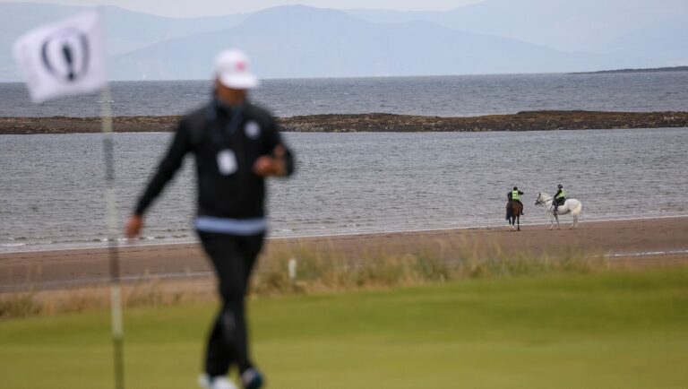 Police on horseback patrol the beach near the fifth hole at the British Open Golf Championships at Royal Troon golf club in Troon, Scotland, Tuesday, July 16, 2024.