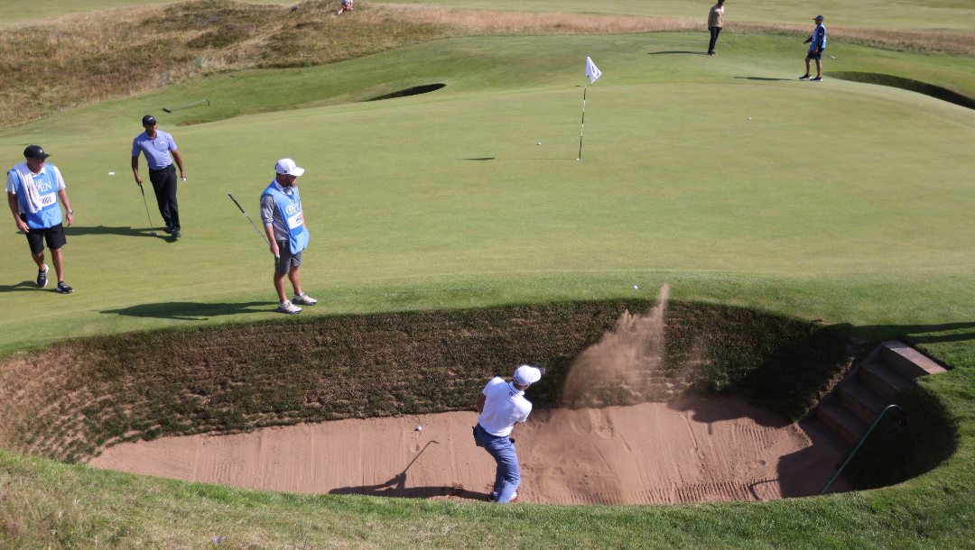 Justin Thomas of the United States plays out of a bunker on the 5th hole during a practice round for the British Open Golf Championships at Royal Troon golf club in Troon, Scotland, Monday, July 15, 2024.