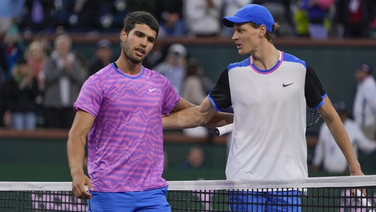 Carlos Alcaraz, of Spain, left, talks with Jannik Sinner, of Italy, after defeating him in a semifinal match at the BNP Paribas Open tennis tournament, Saturday, March 16, 2024, in Indian Wells, Calif. Alcaraz is the defending champion and Sinner is the top-seeded man at Wimbledon, where play begins on Monday, July 1.