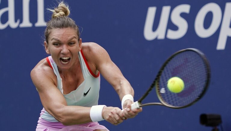 Simona Halep, of Romania, returns a shot to Daria Snigur, of Ukraine, during the first round of the U.S. Open tennis championships, on Aug. 29, 2022, in New York. Former top-ranked tennis player Simona Halep will go to sport’s highest court Wednesday, Feb. 7, 2024 to challenge her four-year ban in a doping case. The Court of Arbitration for Sport in Lausanne, Switzerland says Halep plans to attend in person when the appeal opens for a closed-doors hearing.
