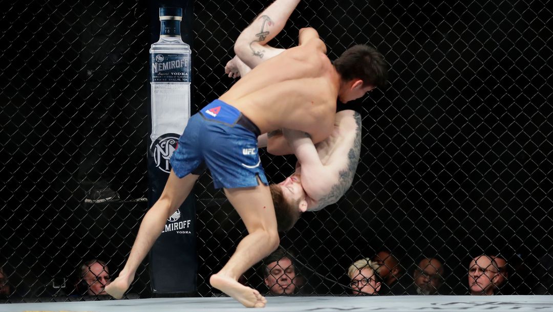 Mario Bautista slams Cory Sandhagen to the mat during the first round of a bantamweight mixed martial arts bout at UFC Fight Night.