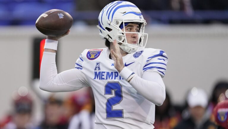 Memphis quarterback Seth Henigan (2) looks to throw a pass during the first half of the Liberty Bowl NCAA college football game against Iowa State, Dec. 29, 2023, in Memphis, Tenn.