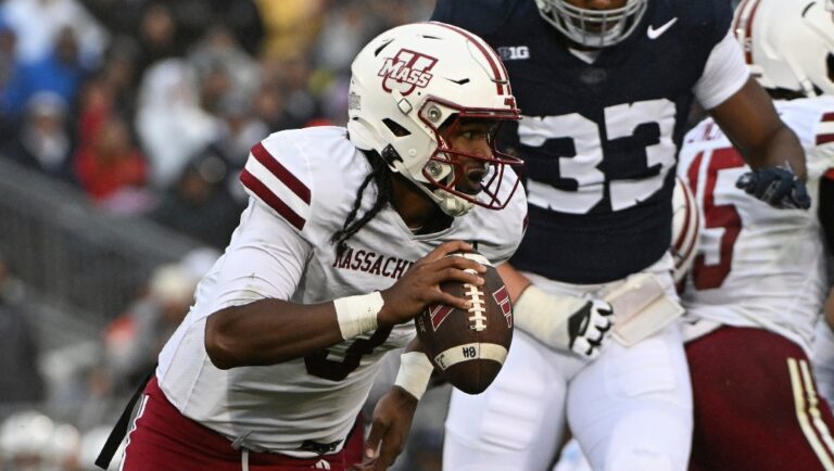 Massachusetts quarterback Taisun Phommachanh (3) scrambles against Penn State during the first half of an NCAA college football game, Saturday, Oct. 14, 2023, in State College, Pa. (AP Photo/Barry Reeger)