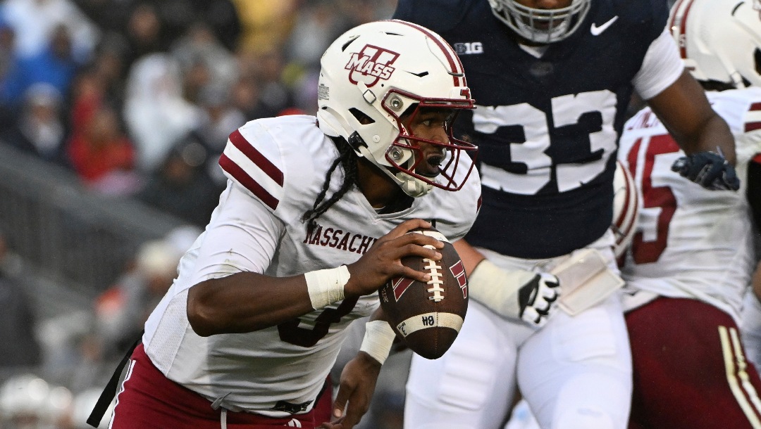 Massachusetts quarterback Taisun Phommachanh (3) scrambles against Penn State during the first half of an NCAA college football game, Saturday, Oct. 14, 2023, in State College, Pa. (AP Photo/Barry Reeger)