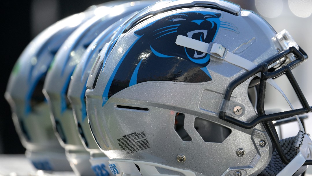 Carolina Panthers helmets are viewed on the sideline during the first half of an NFL football game against the Jacksonville Jaguars, Sunday, Dec. 31, 2023, in Jacksonville, Fla. (AP Photo/Phelan M. Ebenhack)