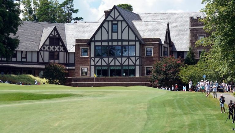 Joohyung Kim, of South Korea, hits to the ninth hole during the final round of the Wyndham Championship golf tournament in Greensboro, N.C., Sunday, Aug. 7, 2022.