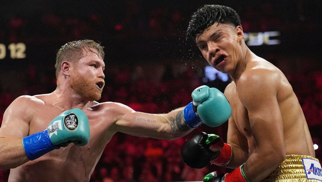 Canelo Alvarez hits Jaime Munguia in a super middleweight title fight Saturday, May 4, 2024, in Las Vegas.