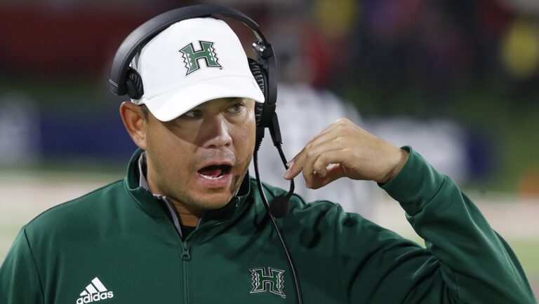 Hawaii coach Timmy Chang talks to his assistants in a loss to Fresno State during the second half of an NCAA college football game in Fresno, Calif., Saturday, Nov. 5, 2022.