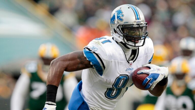 FILE - In this Jan. 1, 2012, file photo, Detroit Lions' Calvin Johnson runs upfield during the first half of an NFL football game against the Green Bay Packers in Green Bay, Wis. Johnson and Minnesota Vikings defensive end Jared Allen are the leading vote getters for The Associated Press 2011 NFL All-Pro Team announced Friday, Jan. 6, 2012, each falling one vote short of being unanimous choices. (AP Photo/Mike Roemer, File)