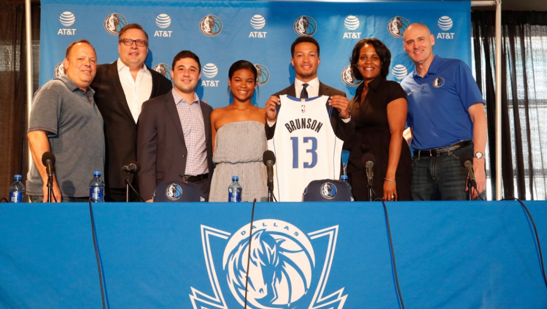 DALLAS, TX - JUNE 22: Donnie Nelson Draft Pick Jalen Brunson and family along with Dallas Mavericks Head Coach Rick Carlisle pose for a photo at the Post NBA Draft press conference on June 22, 2018 at the American Airlines Center in Dallas, Texas. NOTE TO USER: User expressly acknowledges and agrees that, by downloading and or using this photograph, User is consenting to the terms and conditions of the Getty Images License Agreement. Mandatory Copyright Notice: Copyright 2018 NBAE (Photo by Glenn James/NBAE via Getty Images)