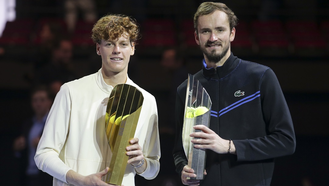 Jannik Sinner of Italy, left, celebrates with the trophy after winning the final match of the Erste Bank Open ATP tennis tournament against Daniil Medvedev of Russia, right, in Vienna, Austria, Sunday, Oct. 29, 2023. Sinner won 7-6 (7), 4-6, 6-3.