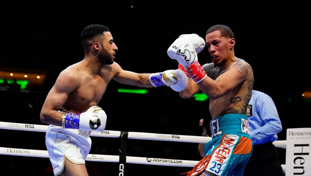 Galal Yafai, left, of England, punches Miguel Cartagena during the first round of a flyweight boxing bout Saturday.