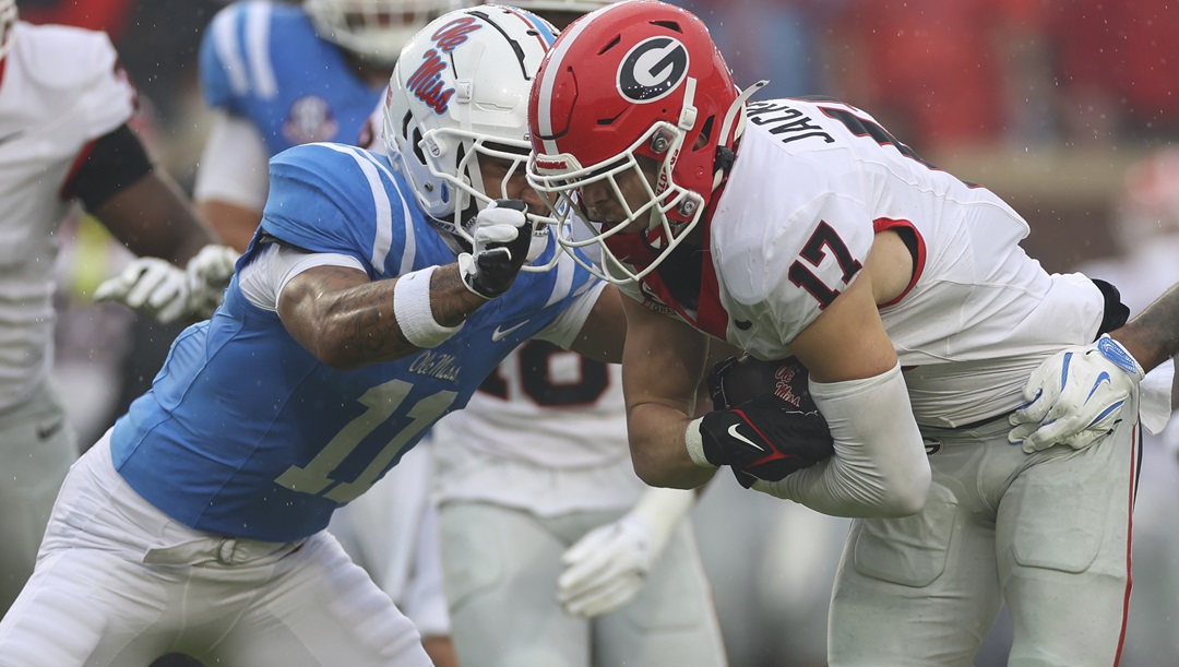 Mississippi wide receiver Jordan Watkins (11) tackles Georgia defensive back Dan Jackson (17) during the first half of an NCAA college football game on Saturday, Nov. 9, 2024, in Oxford, Miss.