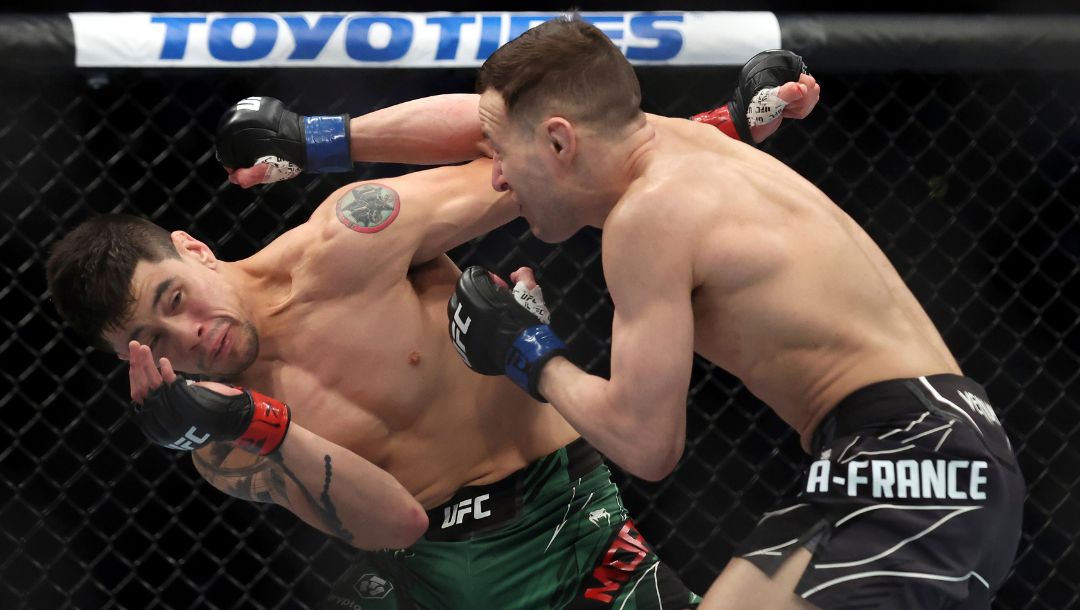 Brandon Moreno, left, avoids a blow from Kai Kara-France in a mixed martial arts flyweight bout at UFC 277 on Saturday.