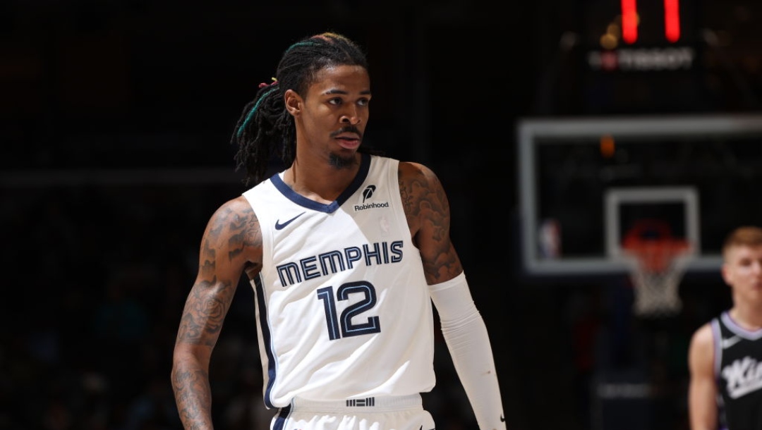 MEMPHIS, TN - DECEMBER 5: Ja Morant #12 of the Memphis Grizzlies looks on during the game against the Sacramento Kings on December 5, 2024 at FedExForum in Memphis, Tennessee. NOTE TO USER: User expressly acknowledges and agrees that, by downloading and or using this photograph, User is consenting to the terms and conditions of the Getty Images License Agreement. Mandatory Copyright Notice: Copyright 2024 NBAE