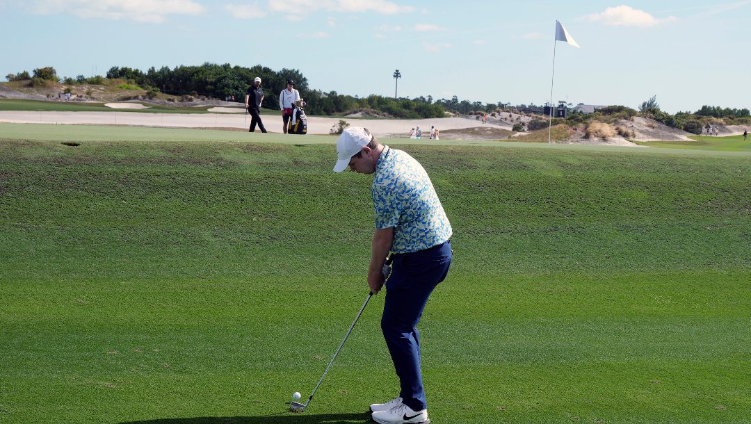 Robert MacIntyre, of Scotland, chips onto the third green during the final round of the Hero World Challenge PGA Tour at the Albany Golf Club, in New Providence, Bahamas, Sunday, Dec. 8, 2024.