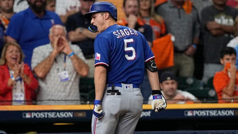 Texas Rangers' Corey Seager reacts after hitting a home run during the first inning of Game 7 of the baseball AL Championship Series against the Houston Astros Monday, Oct. 23, 2023, in Houston.
