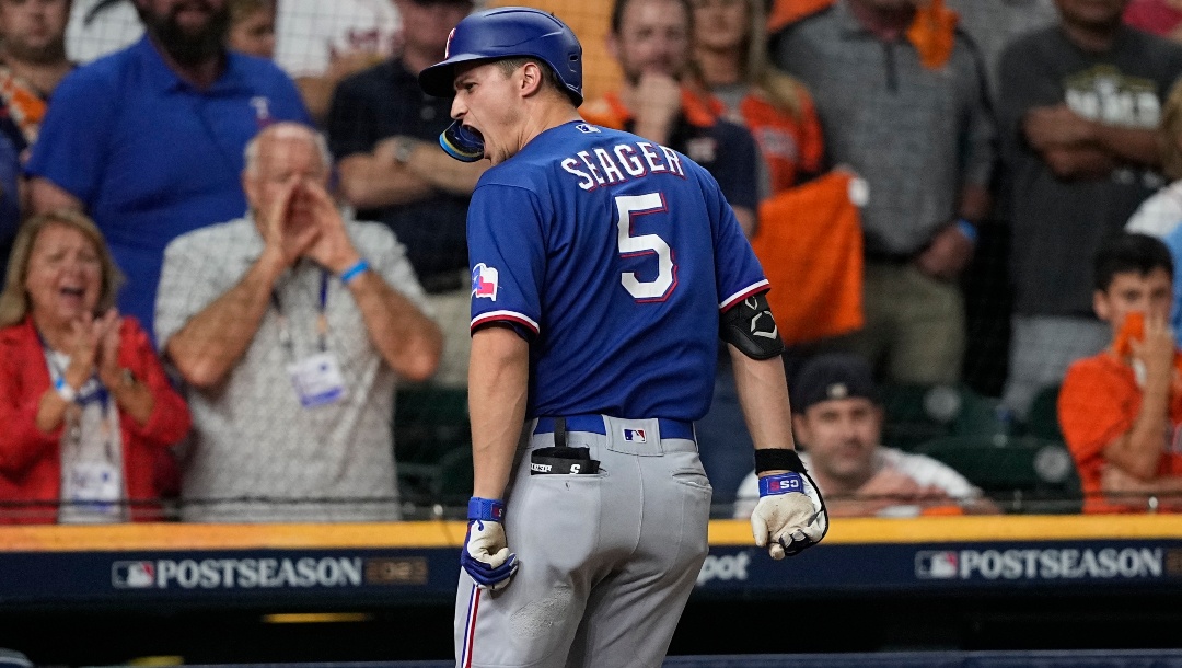 Texas Rangers' Corey Seager reacts after hitting a home run during the first inning of Game 7 of the baseball AL Championship Series against the Houston Astros Monday, Oct. 23, 2023, in Houston.