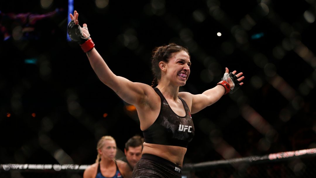 Mackenzie Dern, from the United States, celebrates after defeating countrywoman Amanda Cooper during their UFC.