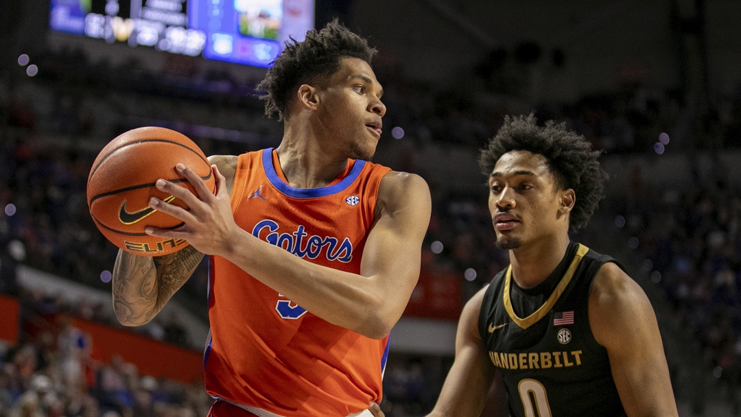 Florida guard Will Richard (5) gets by Vanderbilt guard Tyrin Lawrence (0) during the first half of an NCAA college basketball game Saturday, Feb. 24, 2024, in Gainesville, Fla.