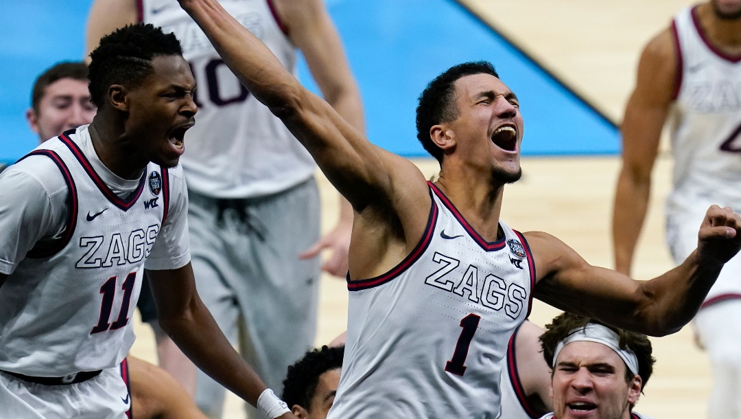 FILE - Gonzaga guard Jalen Suggs (1) celebrates making the game-winning basket against UCLA during overtime in a men's Final Four NCAA college basketball tournament semifinal game, Saturday, April 3, 2021, at Lucas Oil Stadium in Indianapolis. Gonzaga won 93-90. (AP Photo/Michael Conroy, File)