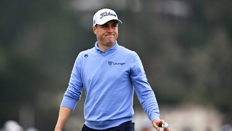 Justin Thomas waves to spectators after putting on the sixth hole at Pebble Beach Golf Links during the second round of the AT&T Pebble Beach Pro-Am golf tournament, Friday, Jan. 31, 2025, in Pebble Beach, Calif.