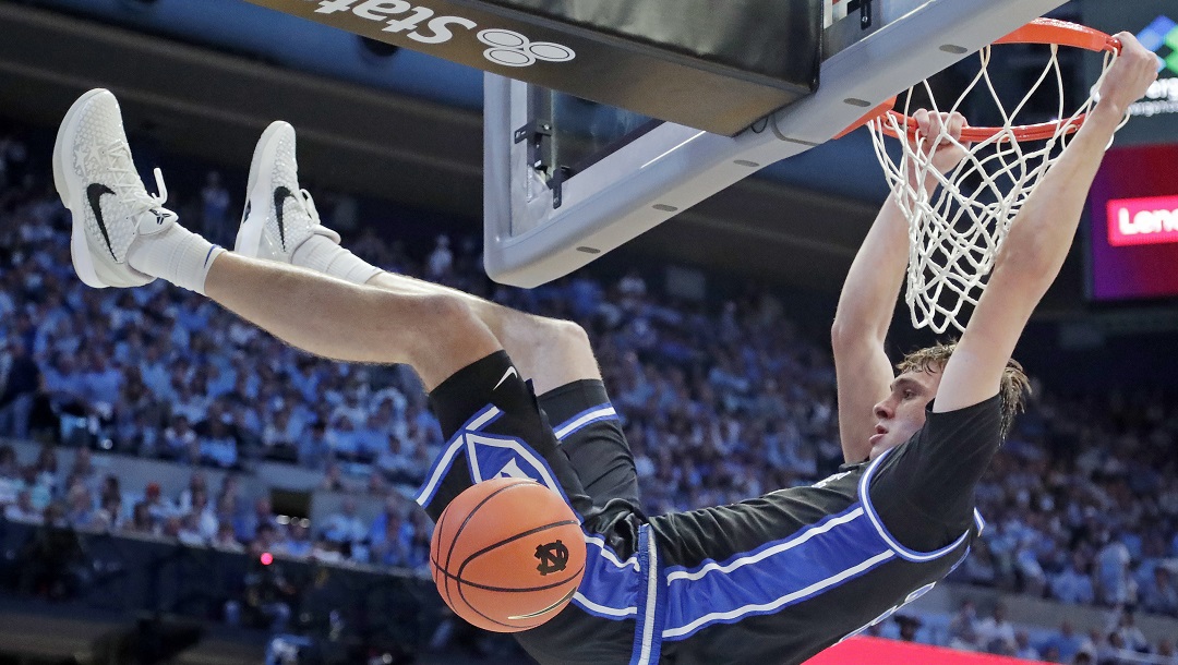 Duke forward Cooper Flagg (2) dunks during the second half of an NCAA college basketball game against North Carolina, Saturday, March 8, 2025, in Chapel Hill, N.C.
