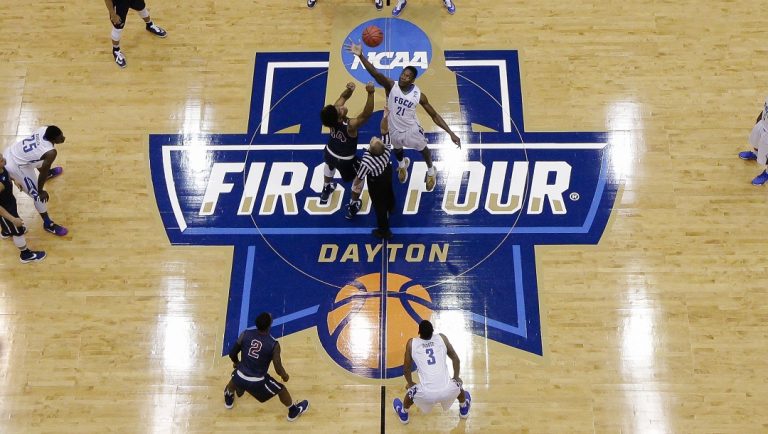Florida Gulf Coast's Demetris Morant (21) and Fairleigh Dickinson's Mike Holloway (34) reach for the ball on the tip off in the first half of a First Four game of the NCAA college basketball tournament, Tuesday, March 15, 2016, in Dayton, Ohio.