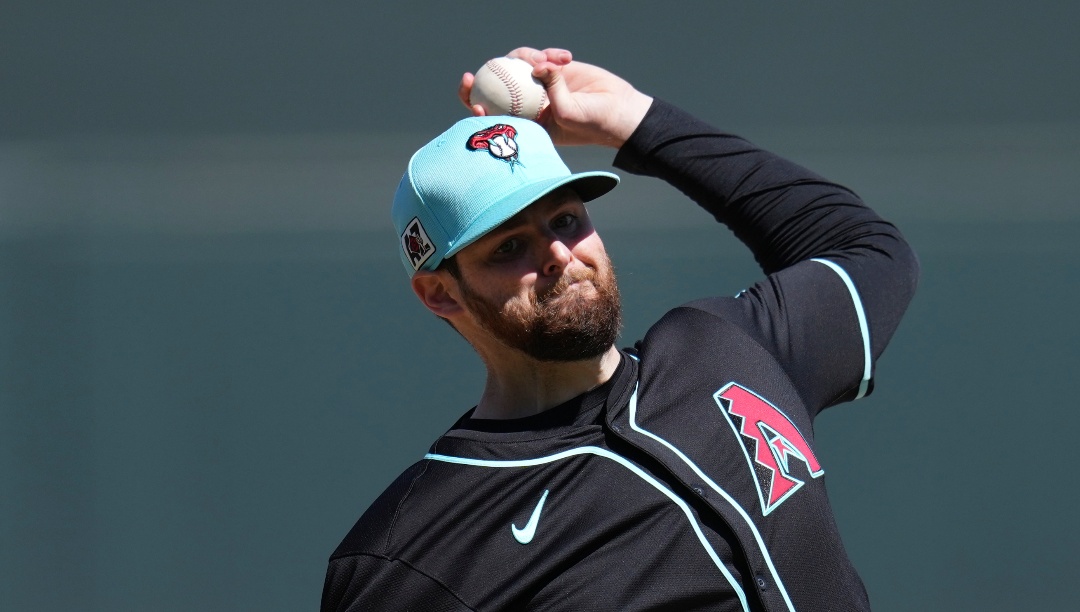 Arizona Diamondbacks starting pitcher Jordan Montgomery warms up during the second inning of a spring training baseball game against the Colorado Rockies Wednesday, March 19, 2025, in Scottsdale, Ariz. (AP Photo/Ross D. Franklin)