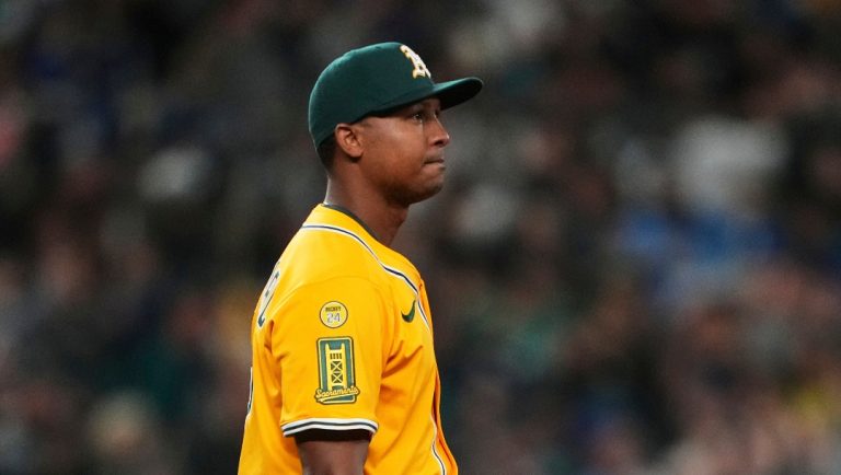 Athletics relief pitcher José Leclerc reacts to giving up a two-run home run to Seattle Mariners' Jorge Polanco during an opening-day baseball game, Thursday, March 27, 2025, in Seattle. (AP Photo/Lindsey Wasson)
