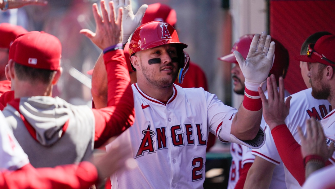 Los Angeles Angels designated hitter Mike Trout celebrates in the dugout after hitting a home run during the sixth inning of a baseball game against the Baltimore Orioles in Anaheim, Calif., Wednesday, April 24, 2024.