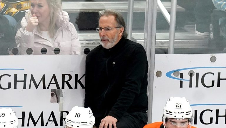 Philadelphia Flyers head coach John Tortorella stands behind his bench during the third period of an NHL hockey game against the Pittsburgh Penguins Monday, Dec. 23, 2024, in Pittsburgh.