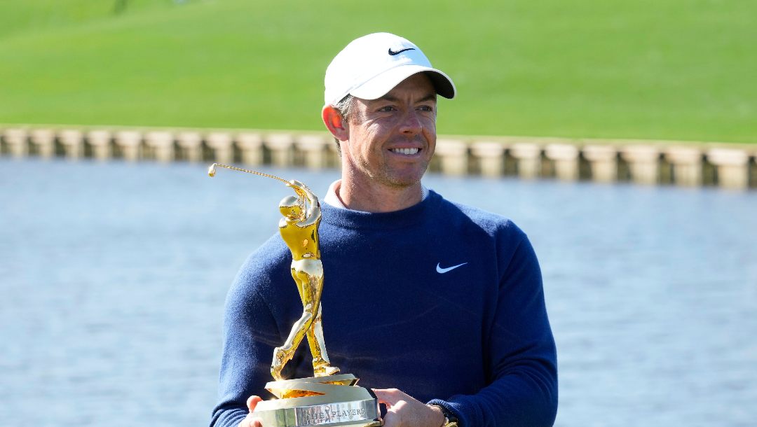 Rory McIlroy, of Northern Ireland, poses for a photo with his trophy after winning a playoff round of The Players Championship golf tournament Monday, March 17, 2025, in Ponte Vedra Beach, Fla.