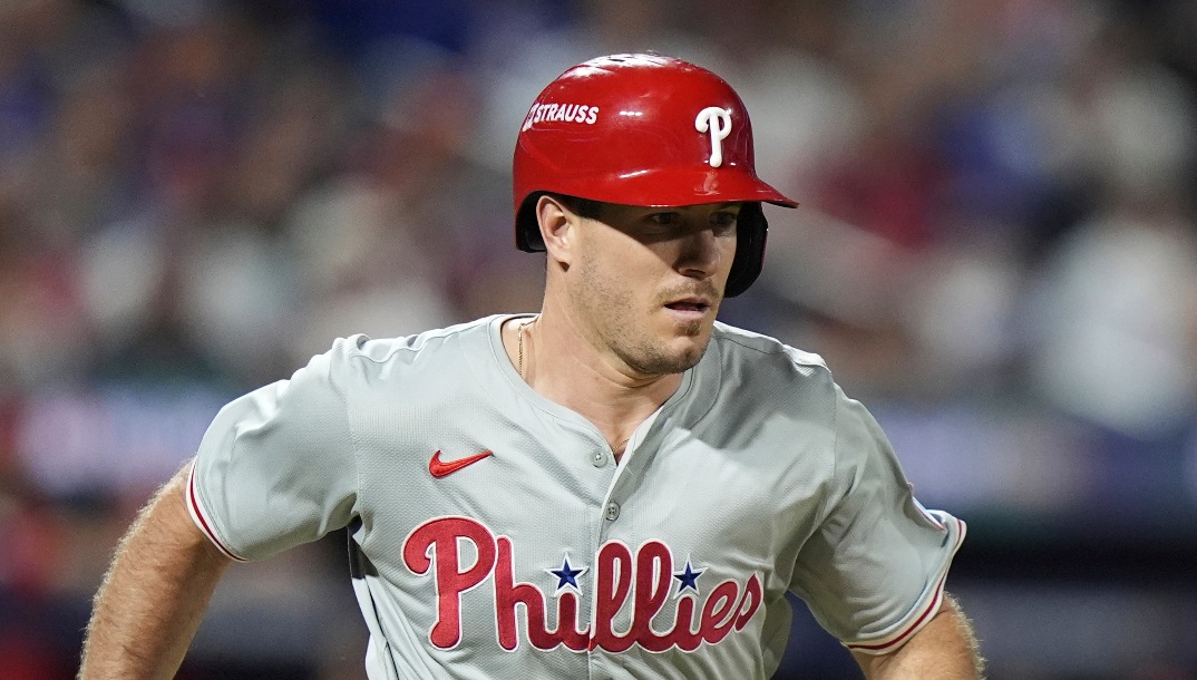Philadelphia Phillies catcher J.T. Realmuto (10) runs to first base during the seventh inning of Game 3 of the National League baseball playoff series against the New York Mets, Tuesday, Oct. 8, 2024, in New York. (AP Photo/Frank Franklin II)