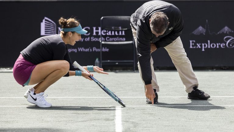 Belinda Bencic, of Switzerland, pleads with the chair umpire that a shot was out during her match against Ons Jabeur, of Tunisia, during the championship match at the Charleston Open tennis tournament in Charleston, S.C., Sunday, April 9, 2023. The ball was called in and Jabeur was given the first set.