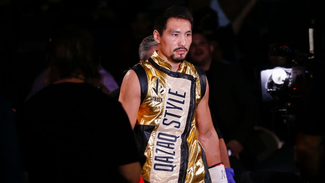 Janibek Alimkhanuly, left, of Kazakhstan, enters the arena before a middleweight boxing match against Hassan N'Dam N'Jikam.