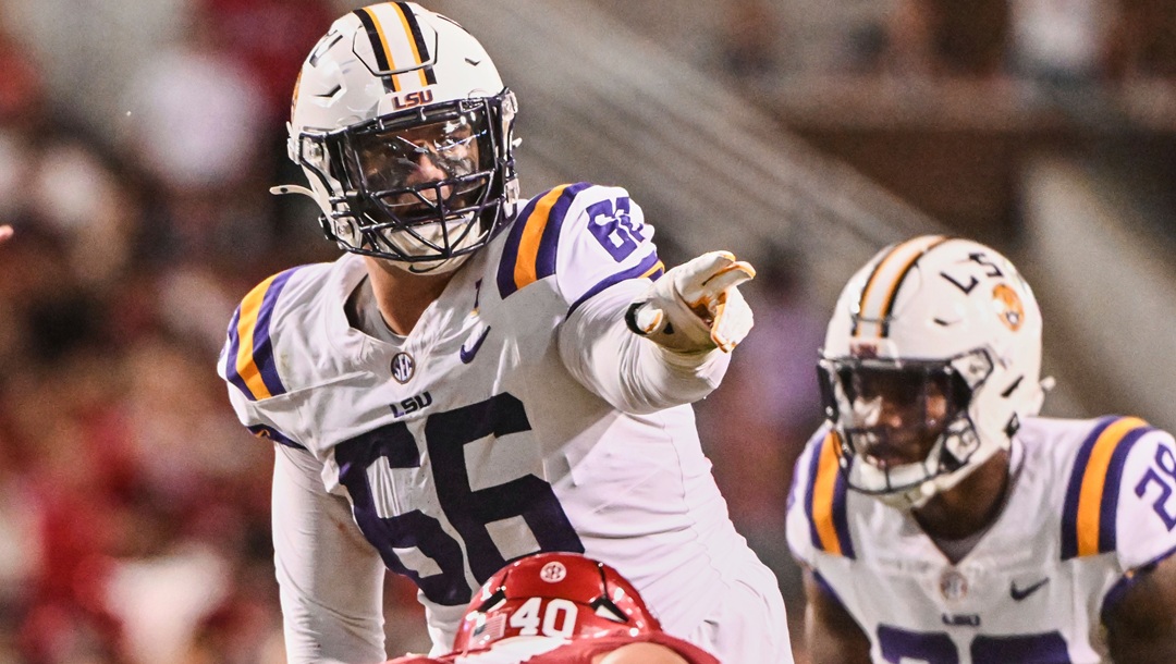 LSU offensive lineman Will Campbell (66) gets ready to run a play against Arkansas during an NCAA college football game Saturday, Oct. 19, 2024, in Fayetteville, Ark.
