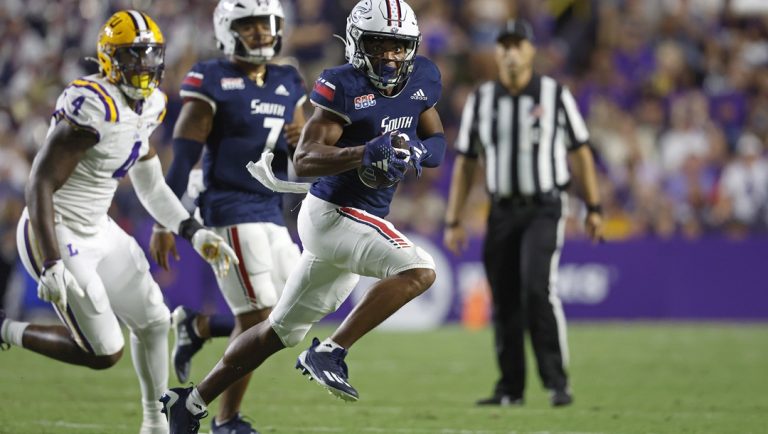 South Alabama wide receiver Jamaal Pritchett, front right, runs the ball past LSU defensive end Bradyn Swinson (4) during the first half of an NCAA college football game in Baton Rouge, La., Saturday, Sept. 28, 2024.