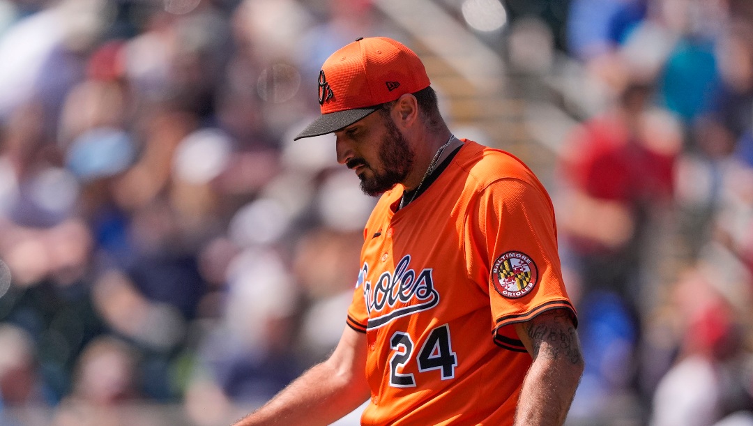 Baltimore Orioles pitcher Zach Eflin (24) walks to the dugout after the second inning of a spring training baseball game against the Minnesota Twins in Fort Myers, Fla., Friday, Feb. 28, 2025. (AP Photo/Gerald Herbert)