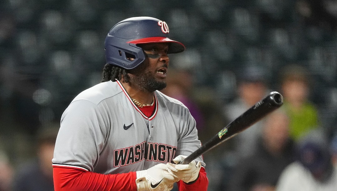 Washington Nationals' Josh Bell singles off Colorado Rockies relief pitcher Zach Agnos in the eighth inning of Game 2 of a split baseball doubleheader Sunday, April 20, 2025, in Denver. (AP Photo/David Zalubowski)
