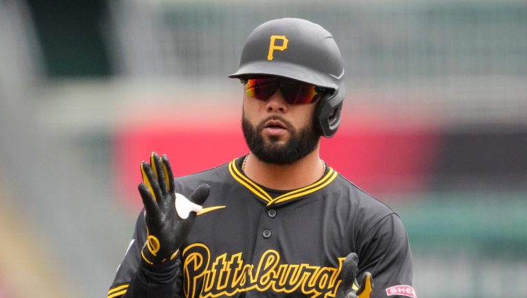 Pittsburgh Pirates' Isiah Kiner-Falefa reacts after hitting a triple during the second inning of a baseball game against the Cincinnati Reds, Sunday, April 13, 2025, in Cincinnati. (AP Photo/Jeff Dean)