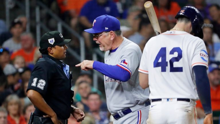 Texas Rangers manager Bruce Bochy, center, argues with home plate umpire Erich Bacchus (12) after Bacchus ejected Bochy, while Houston Astros batter Kyle Tucker waits to the side during the seventh inning of a baseball game Saturday, April 15, 2023, in Houston.