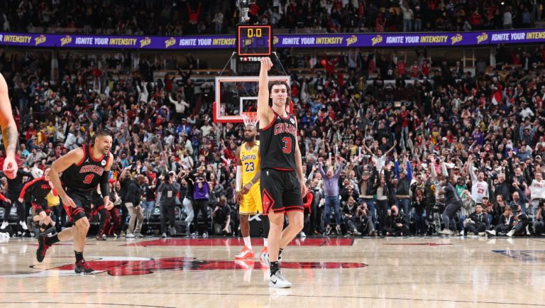 Josh Giddey #3 of the Chicago Bulls celebrates game winning half court shot at the end of the game against the Los Angeles Lakers on March 27, 2025 at United Center in Chicago, Illinois.