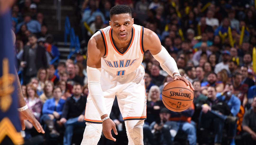 OKLAHOMA CITY, OK - FEBRUARY 9: Russell Westbrook #0 of the Oklahoma City Thunder handles the ball against the Cleveland Cavaliers during the game on February 9, 2017 at Chesapeake Energy Arena in Oklahoma City, Oklahoma. With his 26th triple-double of the season, Westbrook ties Oscar Robertson for the third most triple-doubles in a season.