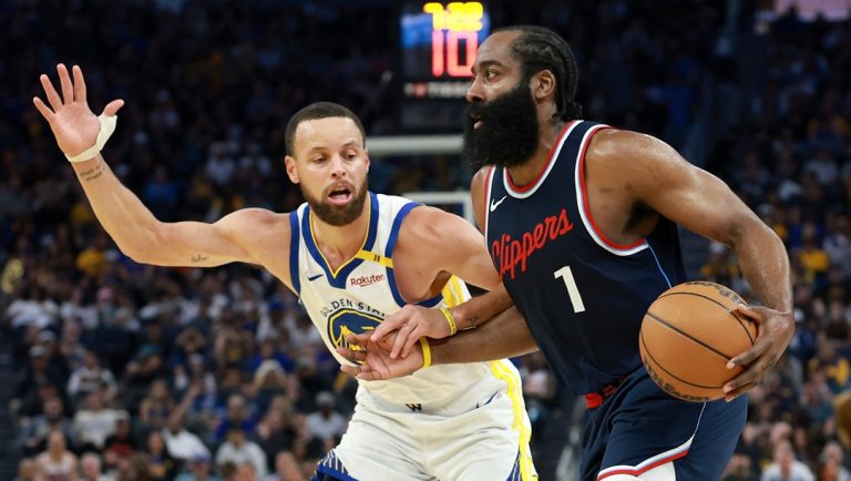 SAN FRANCISCO, CALIFORNIA - APRIL 13: James Harden #1 of the LA Clippers is guarded by Stephen Curry #30 of the Golden State Warriors during the second half at Chase Center on April 13, 2025 in San Francisco, California.
