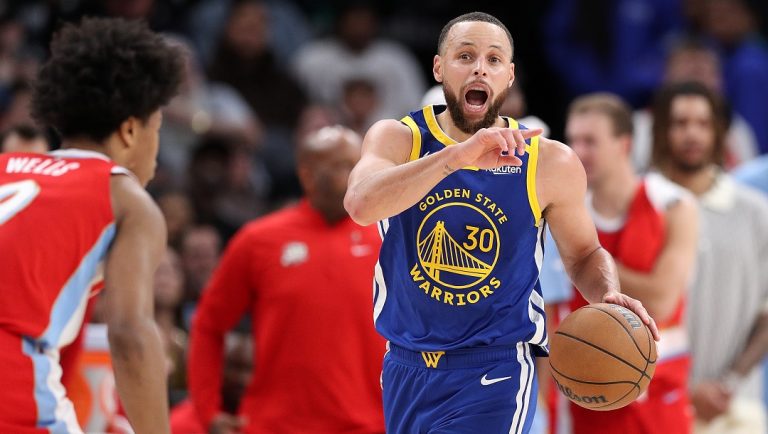 MEMPHIS, TENNESSEE - APRIL 01: Stephen Curry #30 of the Golden State Warriors brings the ball up court against Jaylen Wells #0 of the Memphis Grizzlies during the second half at FedExForum on April 01, 2025 in Memphis, Tennessee.