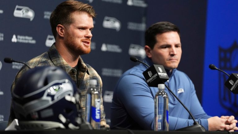 Seattle Seahawks quarterback Sam Darnold, left, speaks as head coach Mike Macdonald, right, looks on during an introductory news conference Thursday, March 13, 2025, at the NFL football team's facilities in Renton, Wash.